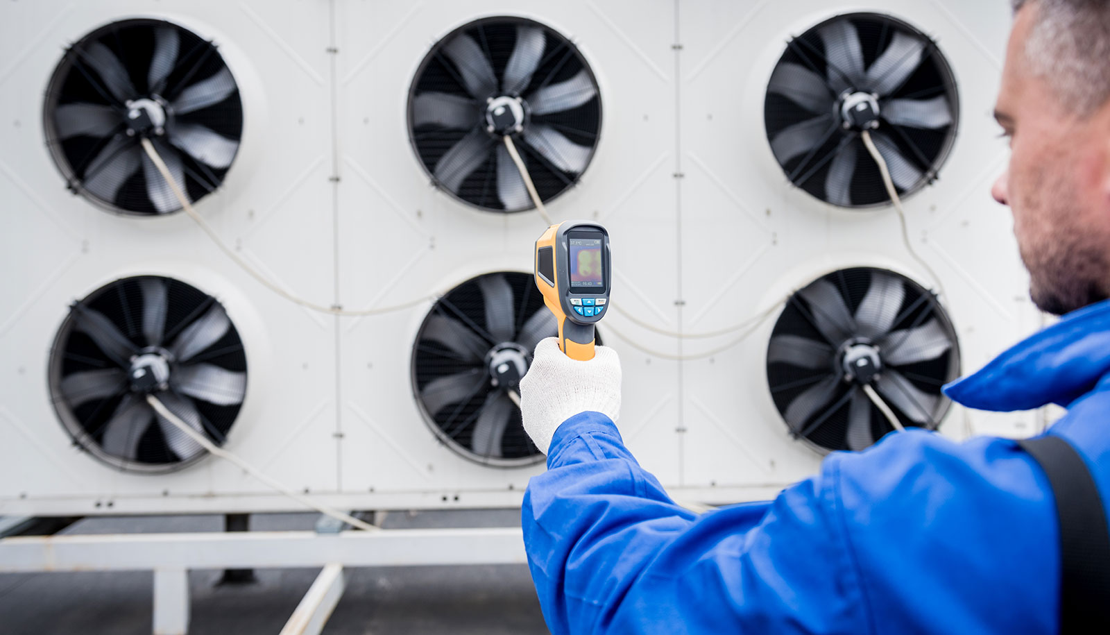 technician-uses-thermal-imaging-infrared-thermometer-check-condensing-unit-heat-exchanger.jpg